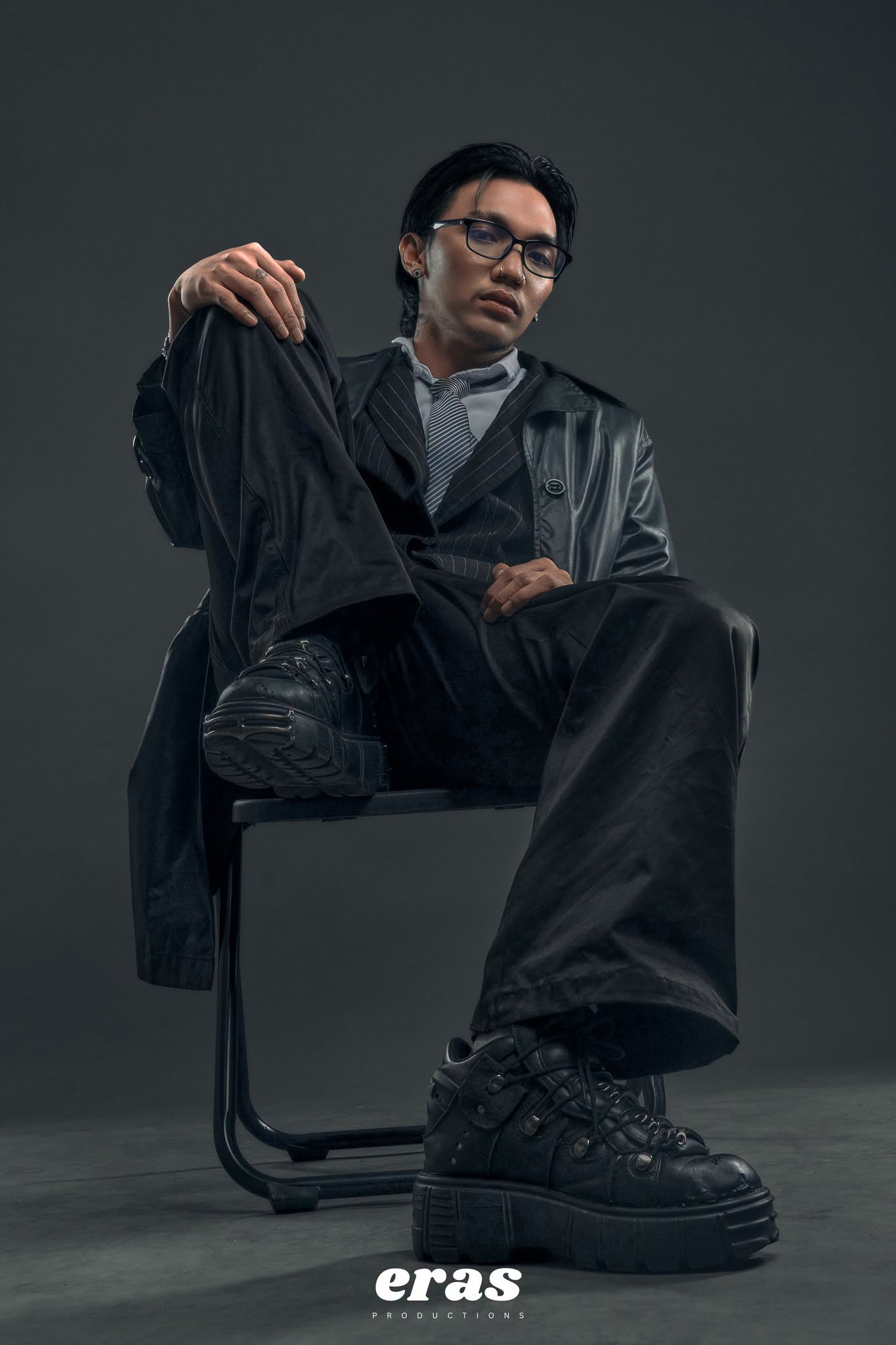 Fashion portrait against charcoal backdrop